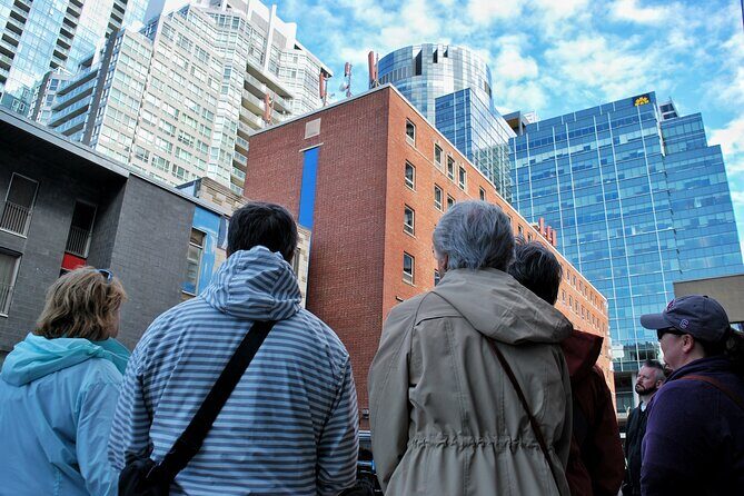 1 Hour Downtown Montreal Tour - Rue Ste-Catherine: the long famous shopping stretch with layered time