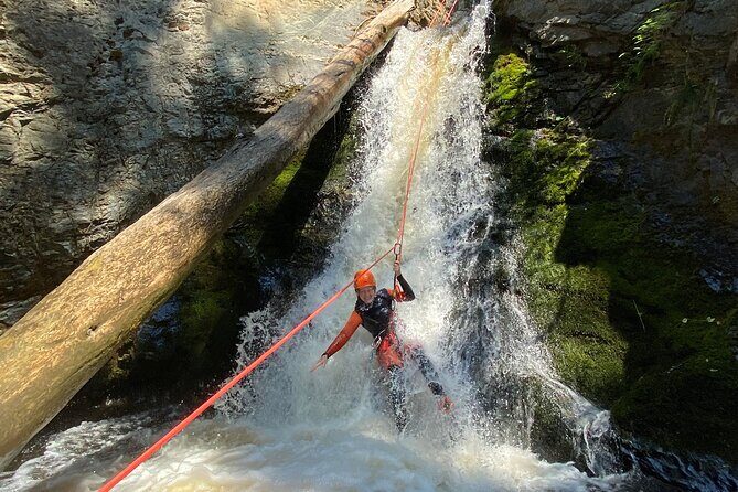 Adrenaline Canyoning Kelowna - Inside the canyon: rappelling waterfalls, sliding, swimming, and ziplining