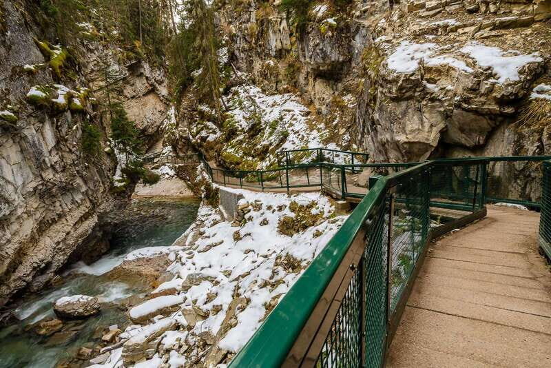 From Banff: Johnston Canyon Guided Icewalk - Hotel pickup in Banff: the short van ride that sets the pace