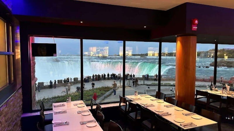 From Toronto: Niagara Falls Tour with Journey & Dinner - Clifton Hill in winter: lights, photos, and breathing room