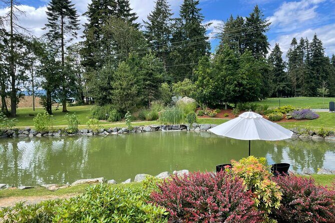 Half-Day Victoria to Cowichan Valley Wine Tour with Tastings - Enrico Winery: deck views, trout-pond vibes, and lunch time