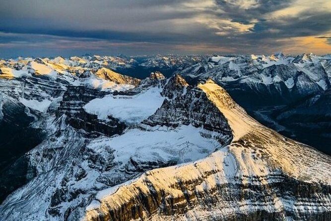 Helicopter Tour over the Canadian Rockies - First lift-off: leaving the valley and hitting Cline Pass at 10,000 ft