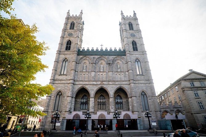 Montreal Premium Driving Night Tour with La Grand Roue Ride - Old Montreal at night: Notre-Dame Basilica passes, then you get photos