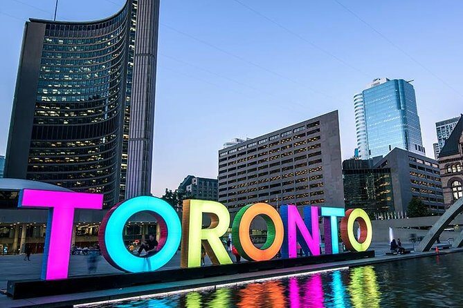 Private Downtown Toronto Walking Tour in English - Dundas Square: Toronto’s Times Square energy, in human scale