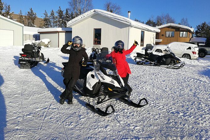 Snowmobile Tour - Trail time: frozen lake riding and woods views