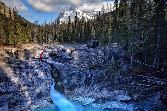 Waterfalls, Lakes & Hidden Gems – Yoho Adventure from Calgary - Natural Bridge over the Kicking Horse River: quick steps, multiple views